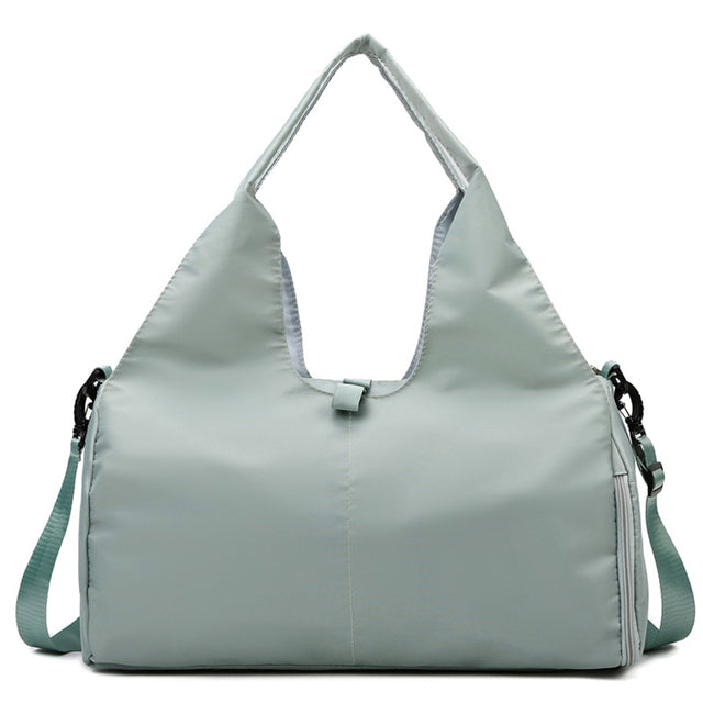 Green women's workout and travel bag with shoe storage