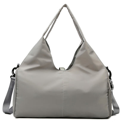 Women's gym travel bag lifestyle image with multiple storage compartments