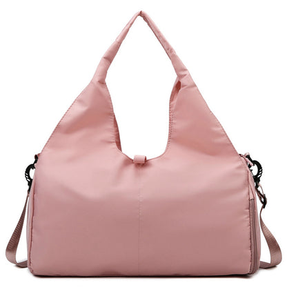 Pink women's fitness travel bag with shoe compartment and yoga mat strap