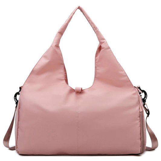 Pink women's fitness travel bag with shoe compartment and yoga mat strap