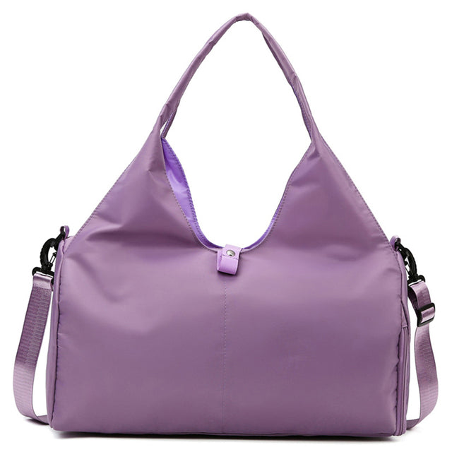 Grey fitness and travel bag for women shown with roomy main compartment